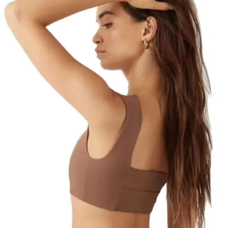 side view of the brown square neck sports bra showing the wide strap