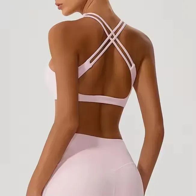 back view of the pink cross back sports bra with double criss cross straps