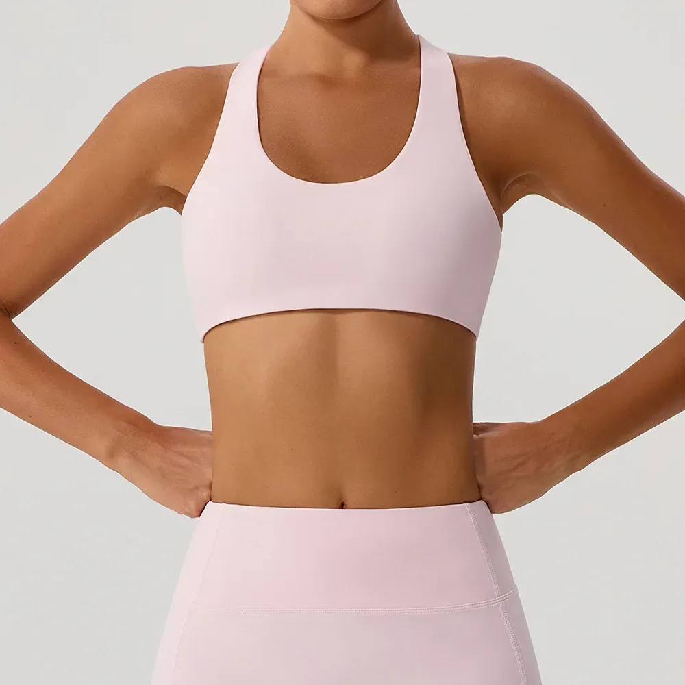 front view of the pink cross back sports bra