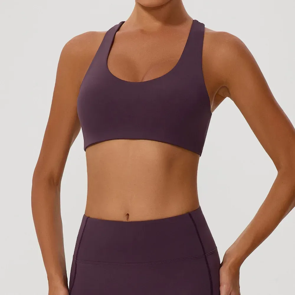 front view of the purple cross back sports bra