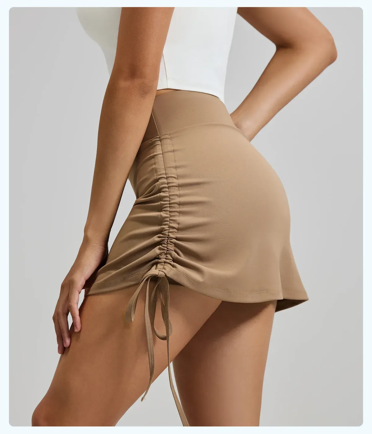 cocoa skort side view showing the ruched drawstring