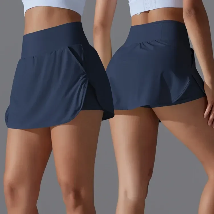 navy athletic skort showing the curved split hem and shorts layer
