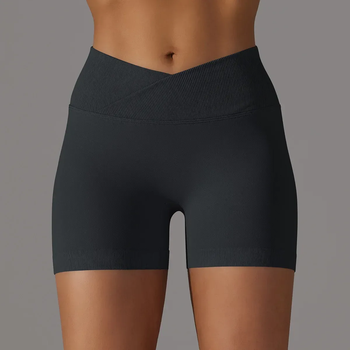 black seamless gym shorts with crossover v waistband, front view