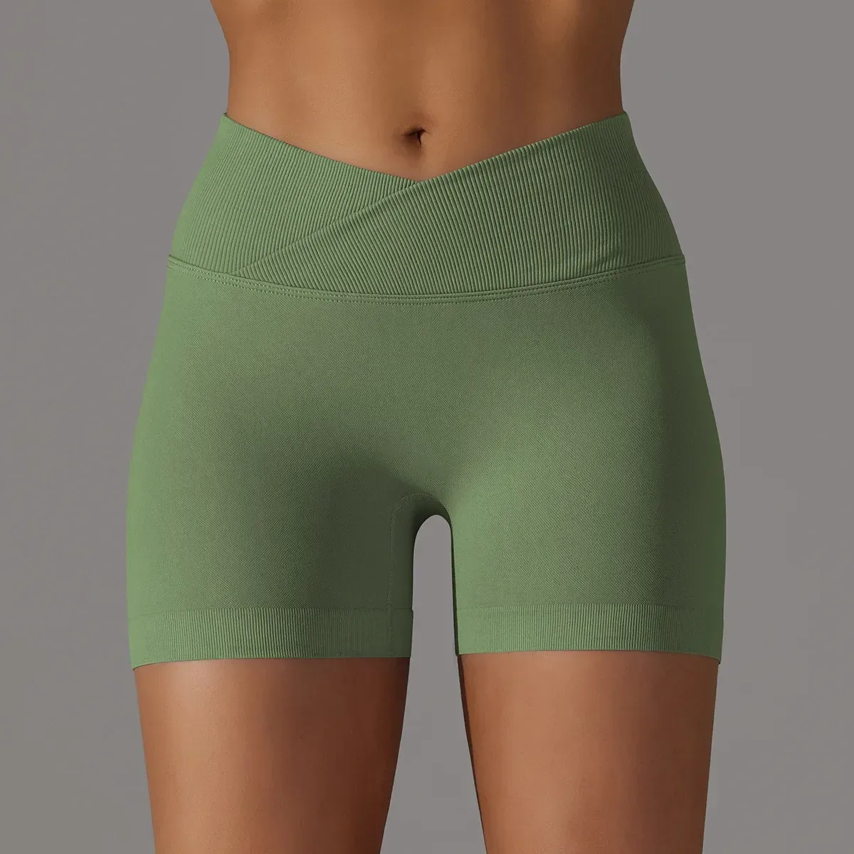 olive seamless scrunch butt gym shorts on a model