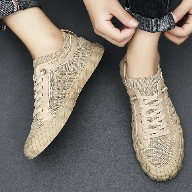 beige mesh sneakers on feet showing the lace up front