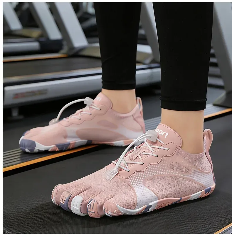 pink print barefoot toe shoes on feet, showing the toe pockets
