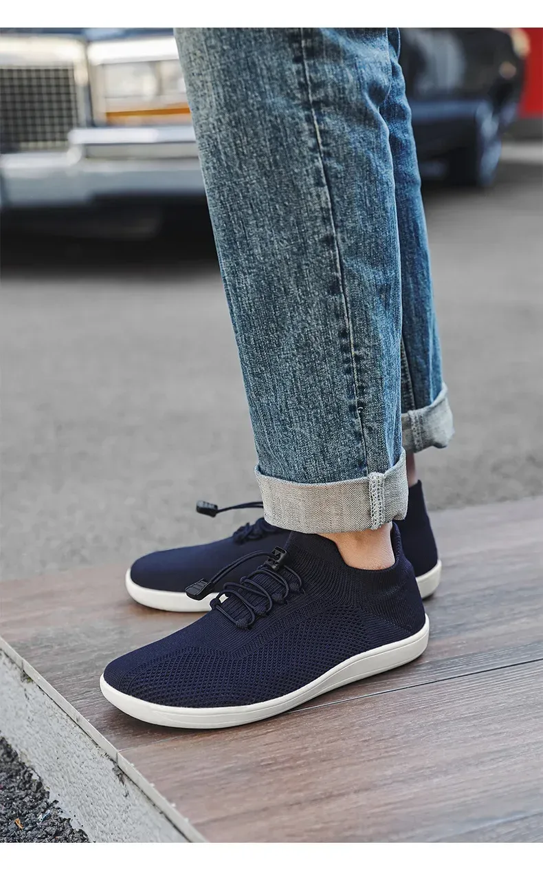 navy barefoot training shoes worn with cuffed jeans
