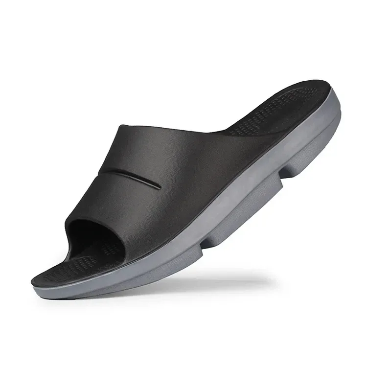 black and grey recovery slide with a wide one piece upper