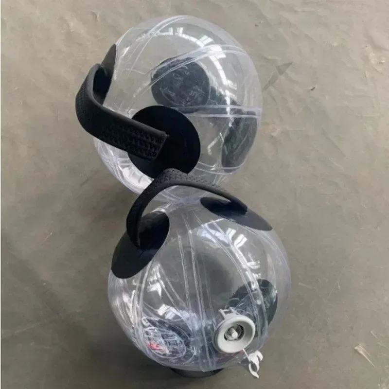 two water filled training balls showing the valve and handles