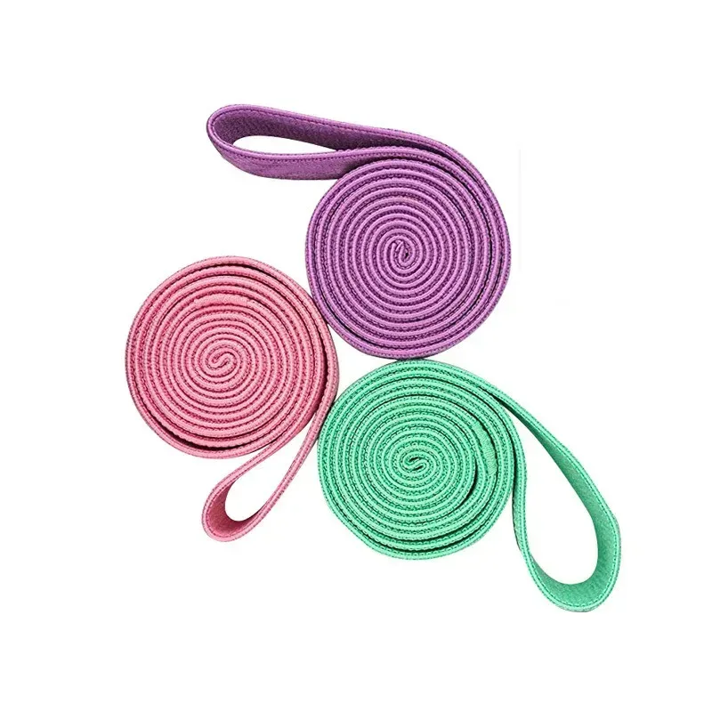 three fabric long resistance bands rolled out to show the long loop