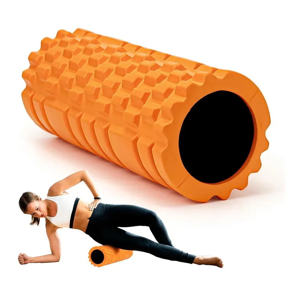 orange textured grid foam roller used on the outer thigh